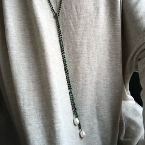 Turquoise beaded necklace with white pearls on end